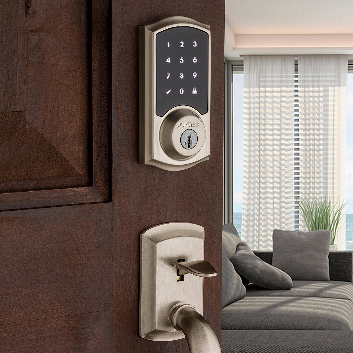 Kwikset Premis lock on a wooden door opening to a bright living room